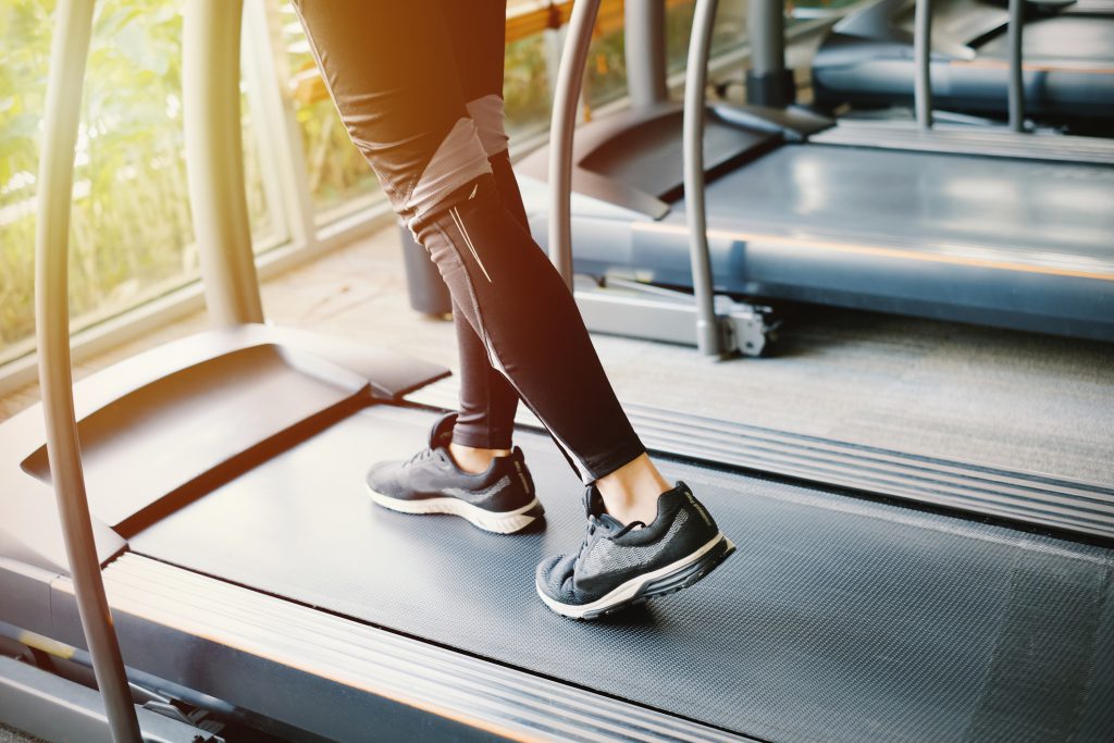 woman's feet on treadmill