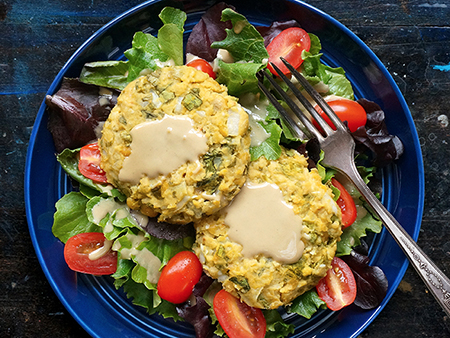 Baked Chickpea Cakes Over Sesame Mixed Greens