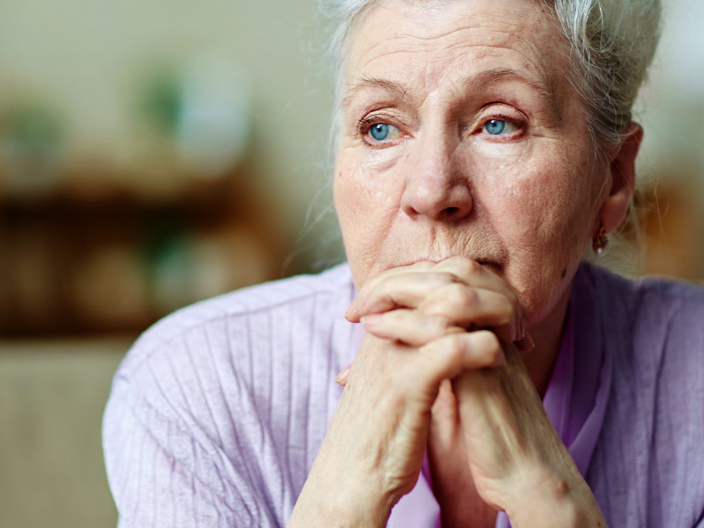 older woman feeling sad