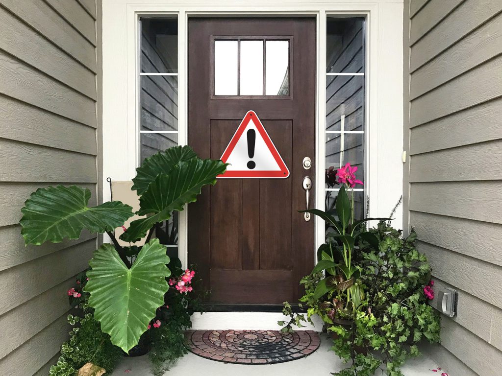 front door with warning sign