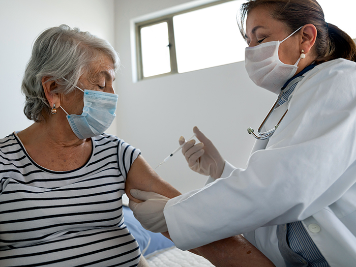 older woman getting vaccine