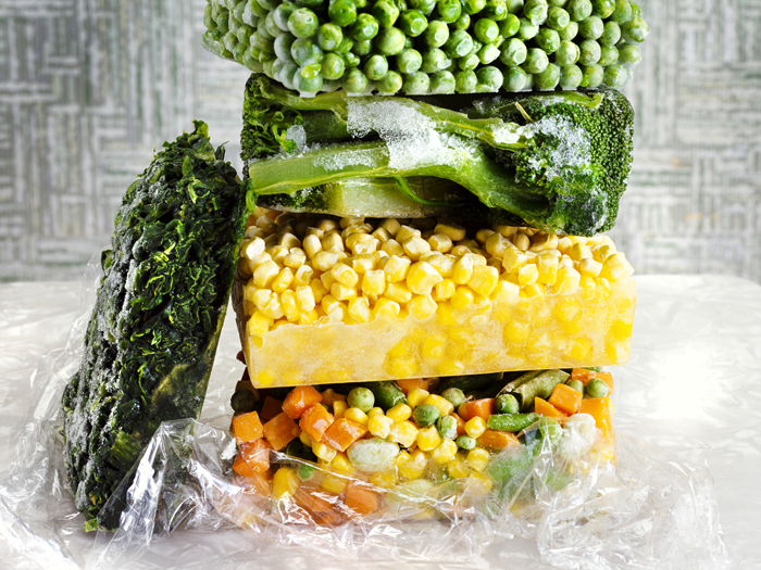 stack of frozen peas, broccoli, corn, and mixed vegetables