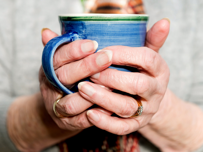 closeup of woman's hands on mug