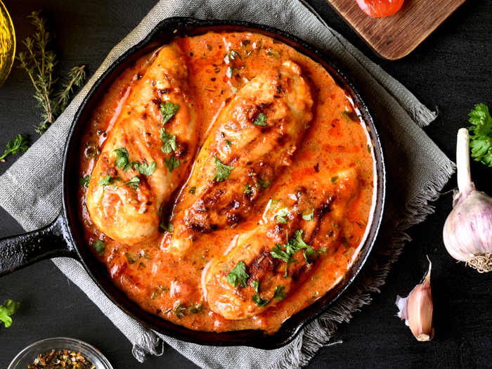 Flavorful chicken breast in pan