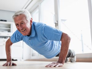 senior man exercising at home