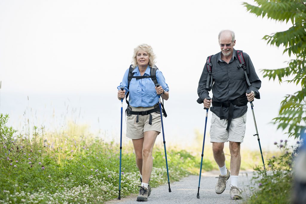 Retired couple Nordic walking