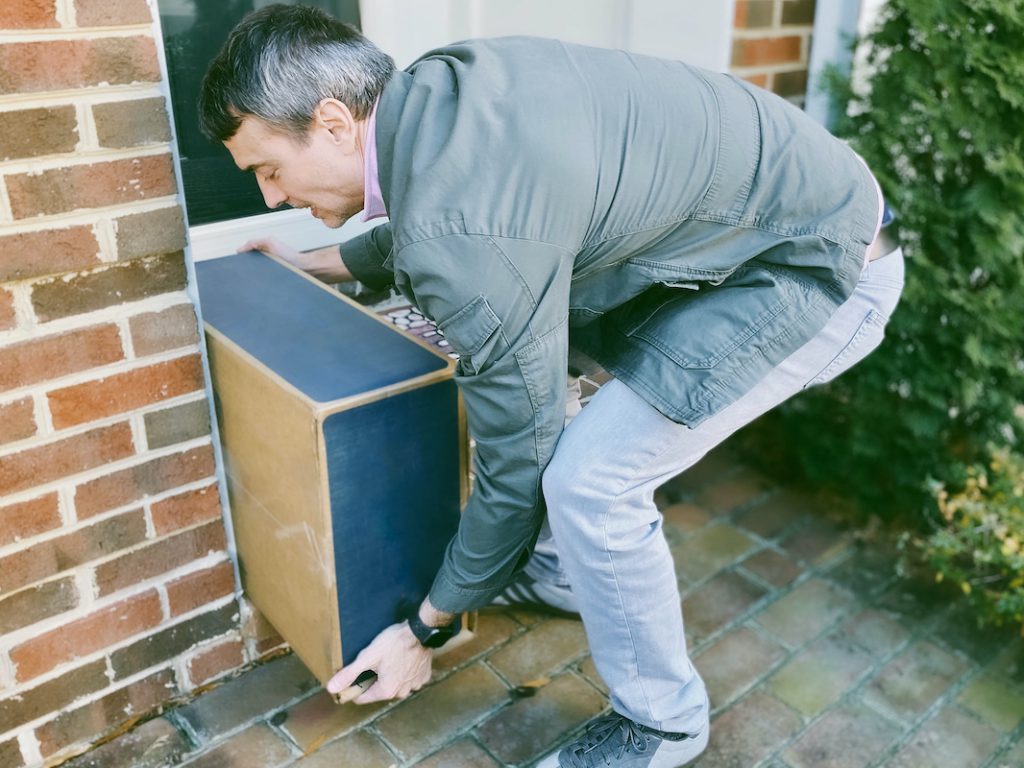 Man picking up a package