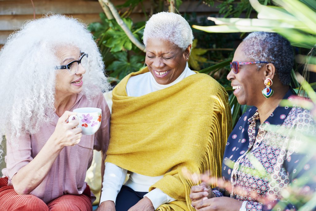 three happy Black senior women talking for a story on aging in place